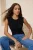 TRENDYOLMİLLA Dames Zwart Effen Mouwloos Getailleerd Blouses