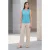 Turquoise top met geplooide schouders en V-hals