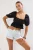 TRENDYOLMİLLA Dames Zwart Effen Kort Getailleerd Blouses