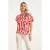 Smashed Lemon Top met korte mouwen en rood-witte golvende print |