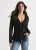 Zwarte jersey blouse met ruches en strik aan de voorkant