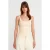 Geribbeld vierkant decolleté mouwloos blouse