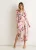 Roze midi-jurk met bloemenprint en glinsterende chiffon overslag