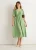Saliegroene midi-jurk met stippenprint en gerimpelde taille