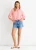 Top de algodón coral con mangas remangables y corbata oversize