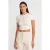 Slim Fit Cropped Blouse Met Knopen