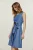 Mouwloze jurk met riem en knoopdetail