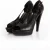 Yves Saint Laurent, zwarte pump van geperforeerd leer.