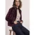Blouson van imitatiebont met gebreide details en print