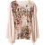 Soepelvallende top met gedrapeerde mouwen en artistieke print – moeiteloze elegantie en modern comfort.
