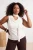 Trendyol Curve Dames Ecru Effen Mouwloos Getailleerd Grote maten Blouses