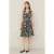 Trenchjurk met abstracte print en riem