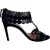 Alaïa sandalen met geschulpte T-band en hakken in zwart suède