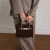 Manfield suède mini handtas donkerbruin