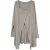 Asymmetrische lange top met moderne enkele knoop.