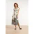 Smashed Lemon Witte maxi jurk met zwarte bladerenprint en gestreepte zoom |