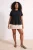 Trendyol Curve Dames Zwart Effen Kort Peplum Grote maten Blouses