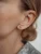 Hey Happiness Oorbellen ‘Black Triad’  goud