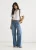 Blauwe jeans met plooien en wijde pijpen