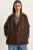 Oversized Jas met Knopenluiting