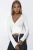 Cropped wikkeltop van zachte tricotstof met kantdetail