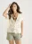 Beige gehaakt vest met knopen aan de voorkant